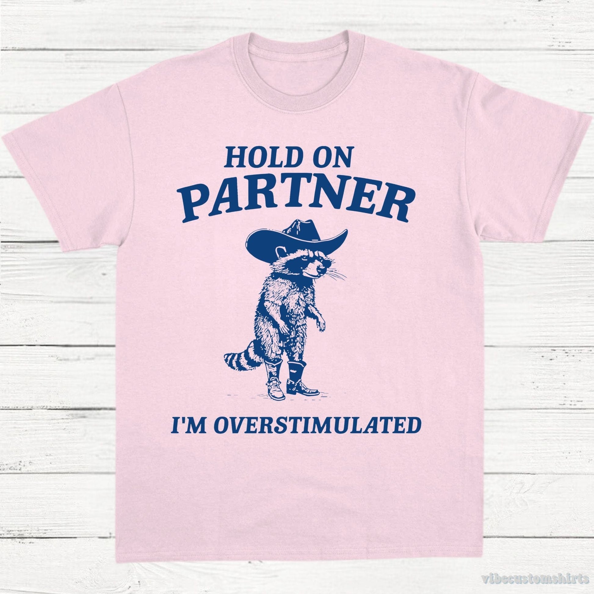 T-Shirt Light Pink / S Hold on Partner I'm Overstimulated Cowboy Raccoon Shirt