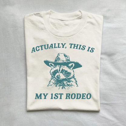 T-Shirt Natural / S Actually This Is My First Rodeo T-Shirt Raccoon