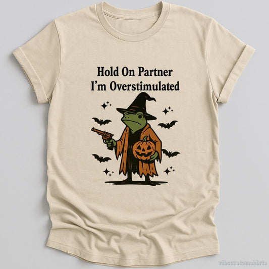 T-Shirt Natural / S Hold On Partner I'm Overstimulated Halloween Witch Frog Shirt