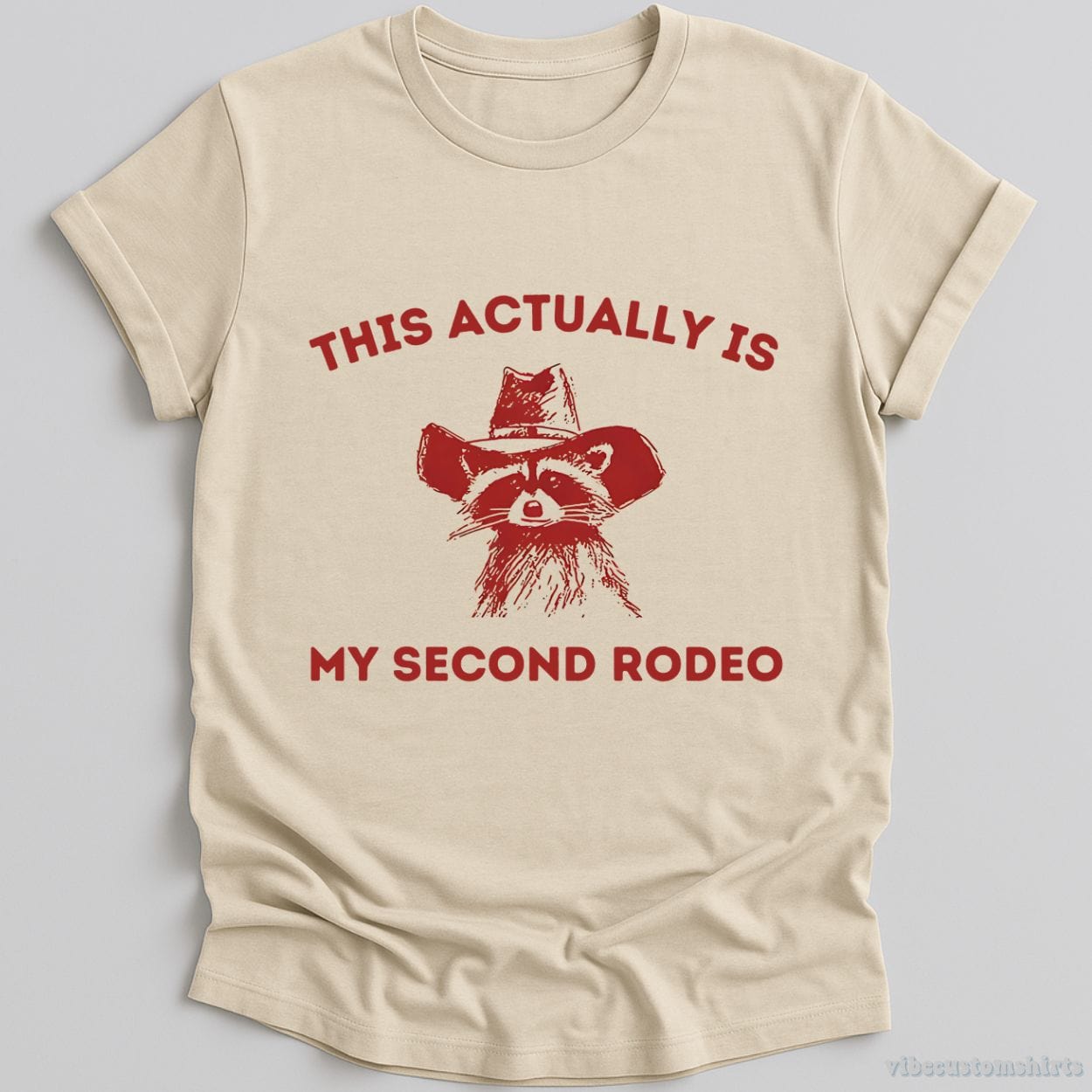 T-Shirt Natural / S This is My Second Rodeo Cowboy Raccoon Shirt