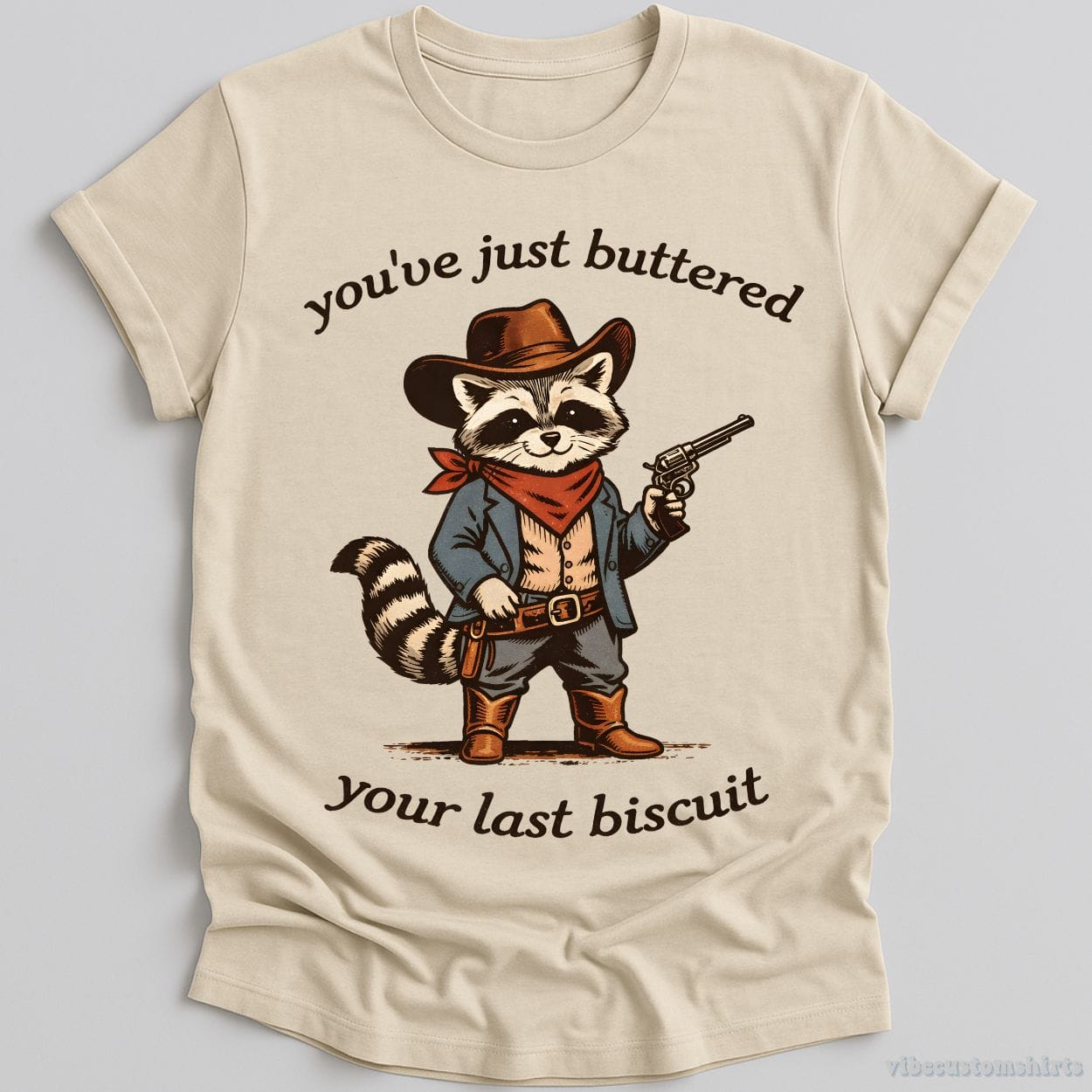 T-Shirt Natural / S You’ve Just Buttered Your Last Biscuit Cowboy Raccoon Shirt